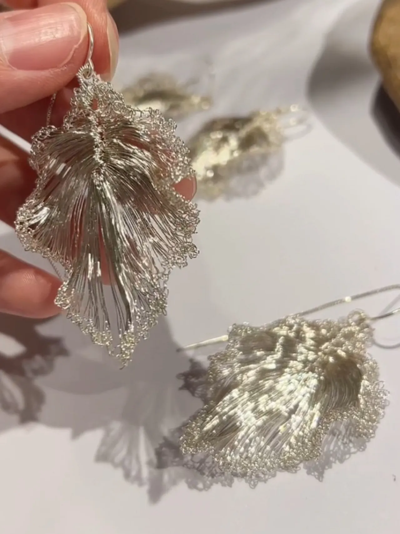 Handcrafted detail of OREYNE Ruffled Leaf earrings