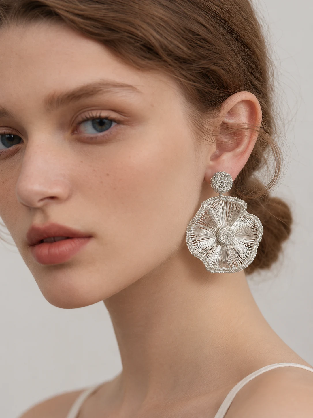 Model wearing OREYNE Radiant Bloom earrings